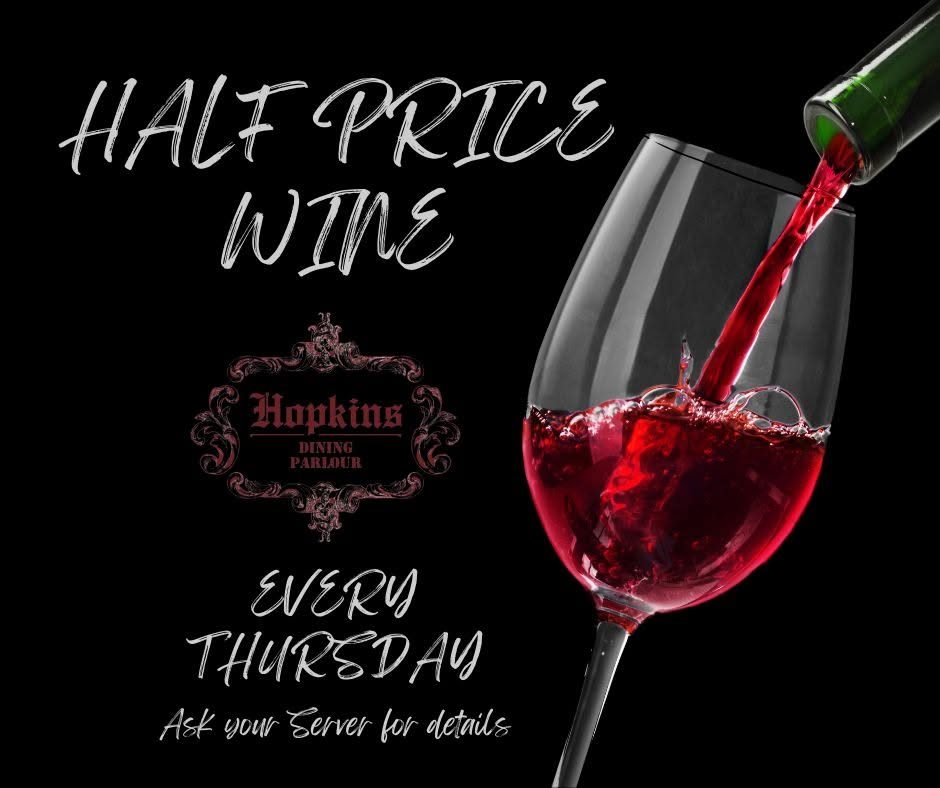 Red wine being poured — half price house wine every Thursday